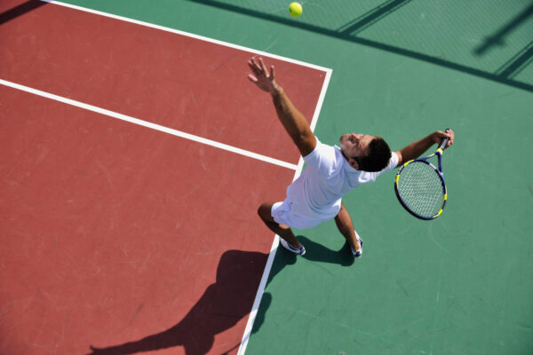 young man playing tennis